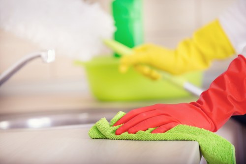 Cleaner preparing a Wimbledon apartment for tenancy handover